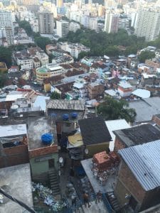 After around 20min we arrived at the most famous spot in Santa Marta: the slab of Michael Jackson. The set location couldn’t be more ideal for his political song “They don’t care about us.” His presence there was a huge turning point for the favela and the video clip called the world’s attention to one of the biggest problems in Brazil. The slab today is the most photographed spot in Santa Marta, and is a square that has events constantly (samba and feijoada every first Saturday of the month), along with a mosaic portrait of the King of Pop made by Romero Brito, and a bronze statue as well. From the slab the view is just spectacular!