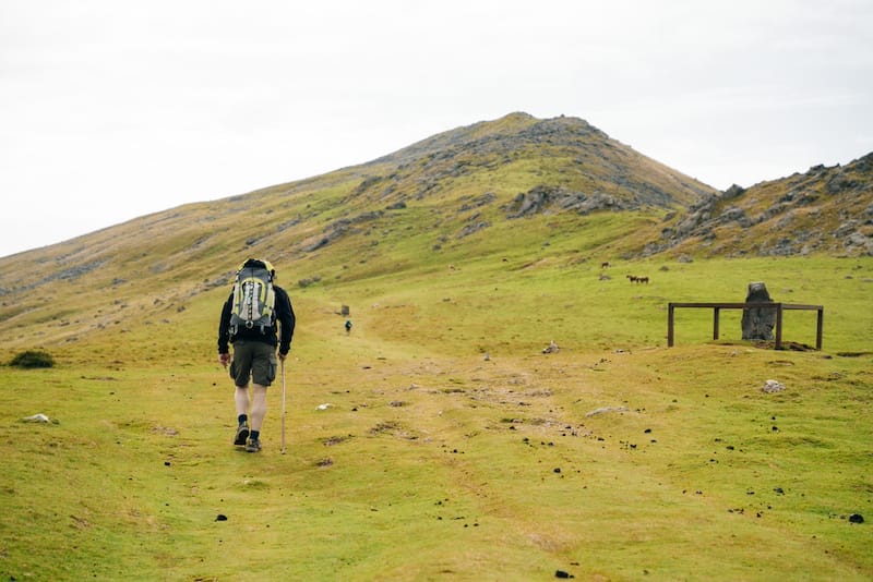 Lone pilgrim walking the Camino de Santiago through the Pyrenees. France